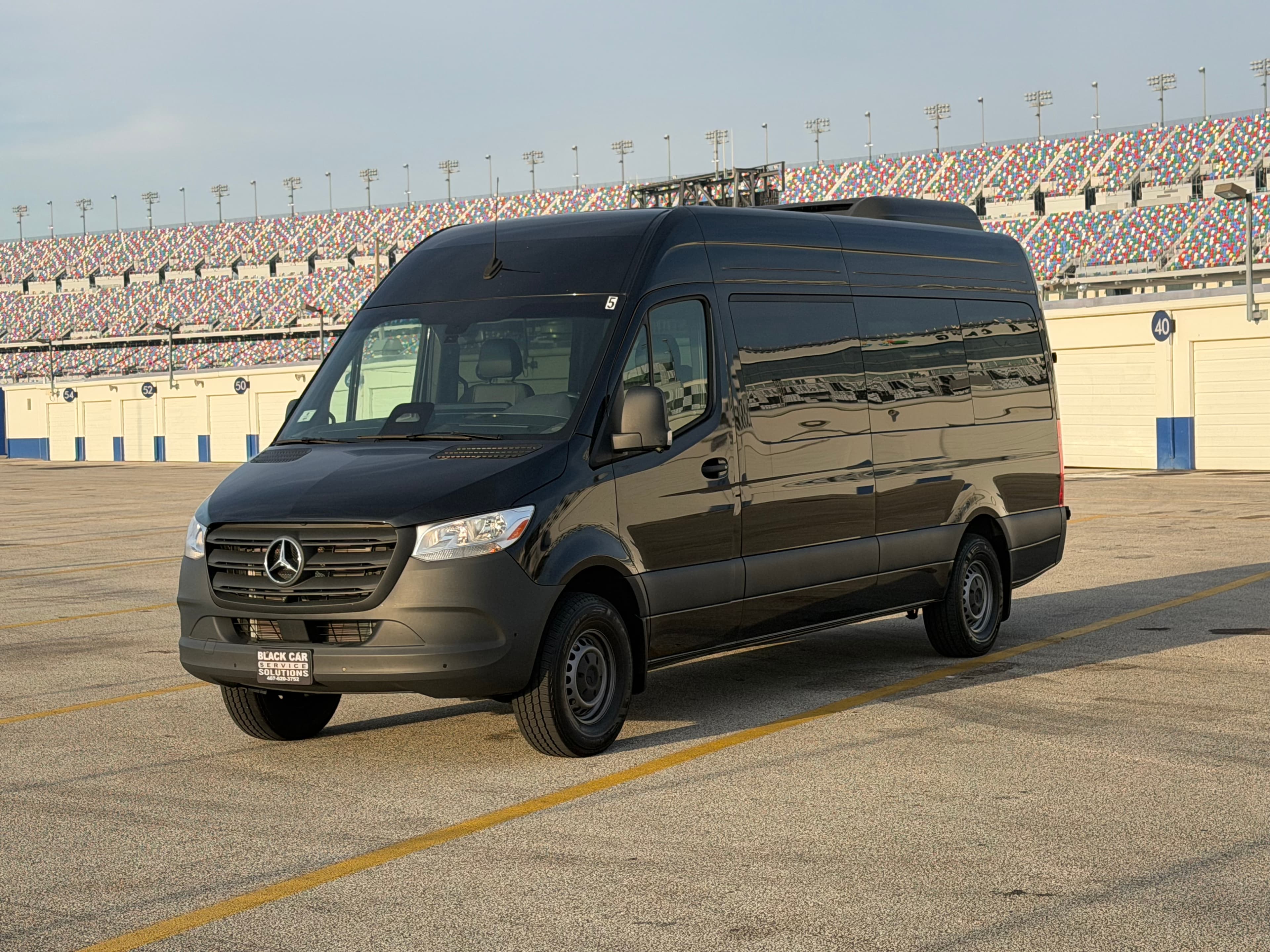 Mercedes Sprinter side view at Daytona Speedway pit area